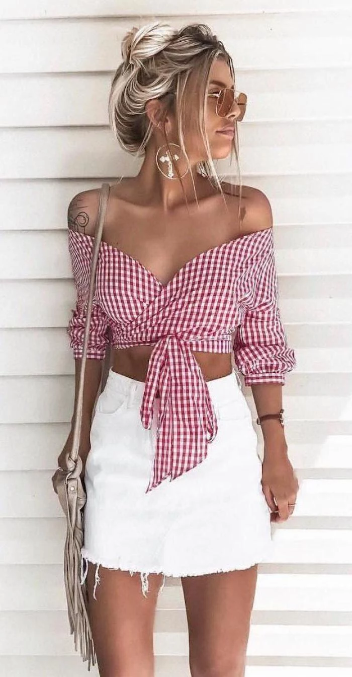 cute summer outfits for teens woman with blonde hair in a bun wearing white denim skirt red and white checkered shirt tied at the waist