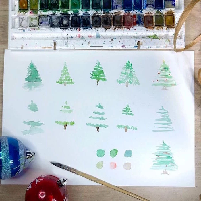 christmas trees, drawn in different ways, watercolor landscape painting, green watercolor trees on white background