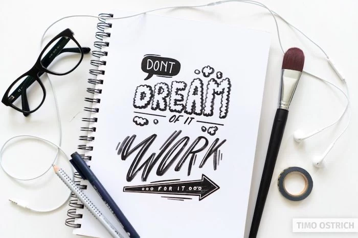 dont dream of it work for it written with black letters in different fonts hand lettering white background