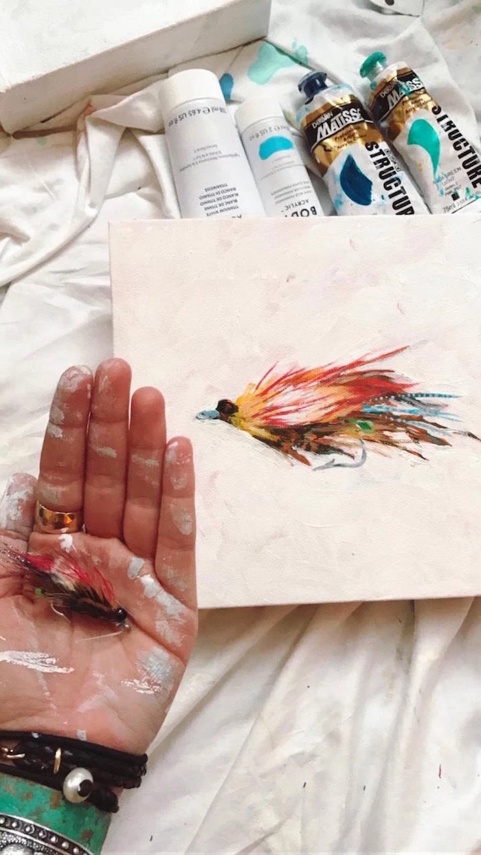 drawing of a feather, painted in different colors, easy paintings for beginners, painted on white background
