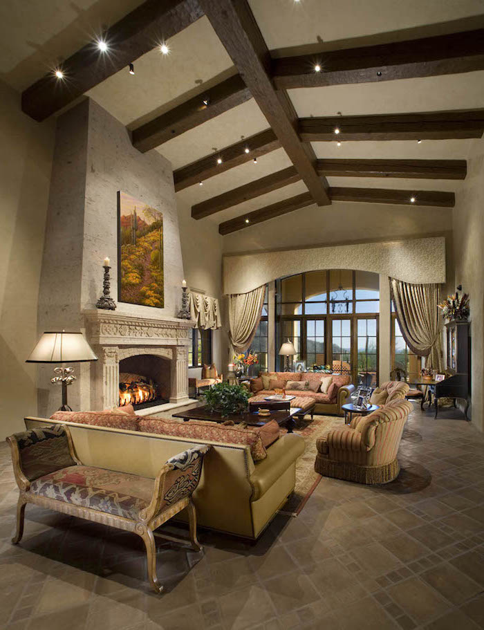 exposed wooden beams on white ceiling, modern farmhouse living room, colorful furniture set, placed in front of a fireplace