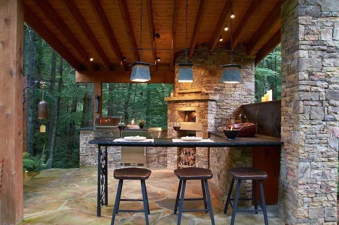 fireplace with barbecue grill outdoor kitchen ideas stone columns and floor marble countertop with three bar stools