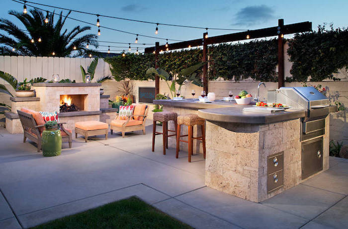 fireplace with lounge are rustic outdoor kitchen kitchen island made of stone with granite countertops and grill