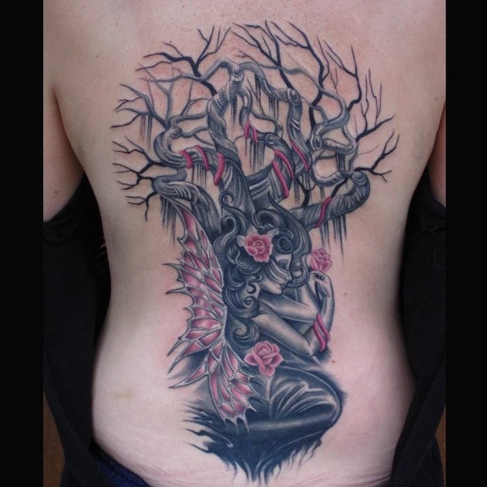 forest fairy with pink winfs tree branches behind her trash polka tattoo ideas pink roses back tattoo