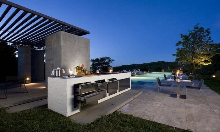 glass dining table with chairs next to a pool outdoor grill ideas white kitchen island with cabinets on stone tiled floor