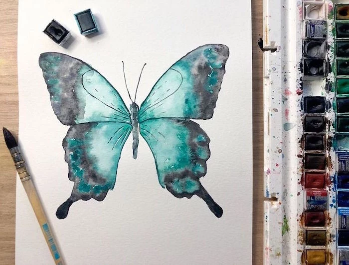 painting of a butterfly, painted with green and black watercolor, easy watercolor painting ideas, white background