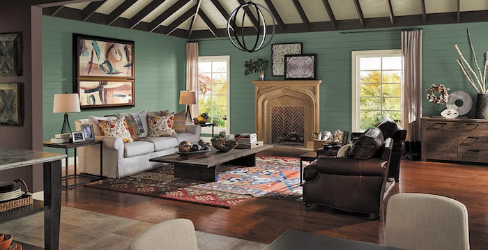 green wooden walls, rustic farmhouse decor, colorful carpet on wooden floor, brown leather sofa, wooden coffee table