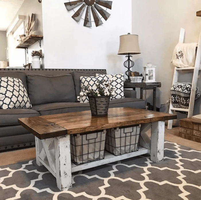 grey sofa with black and white throw pillows, wooden coffee table, farmhouse style homes, grey carpet on wooden floor