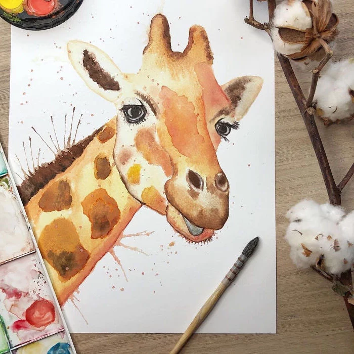painting of a giraffe's head, painted on white background, watercolor painting ideas, placed on wooden surface