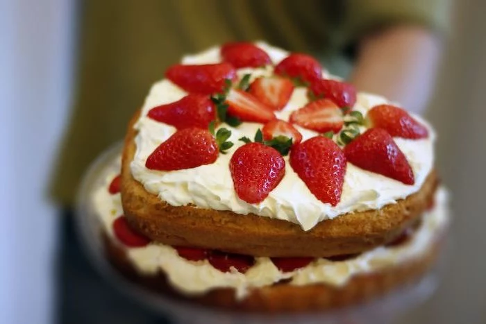 heart shaped victoria sponge cake summer dessert recipes with white buttercream and strawberries on top
