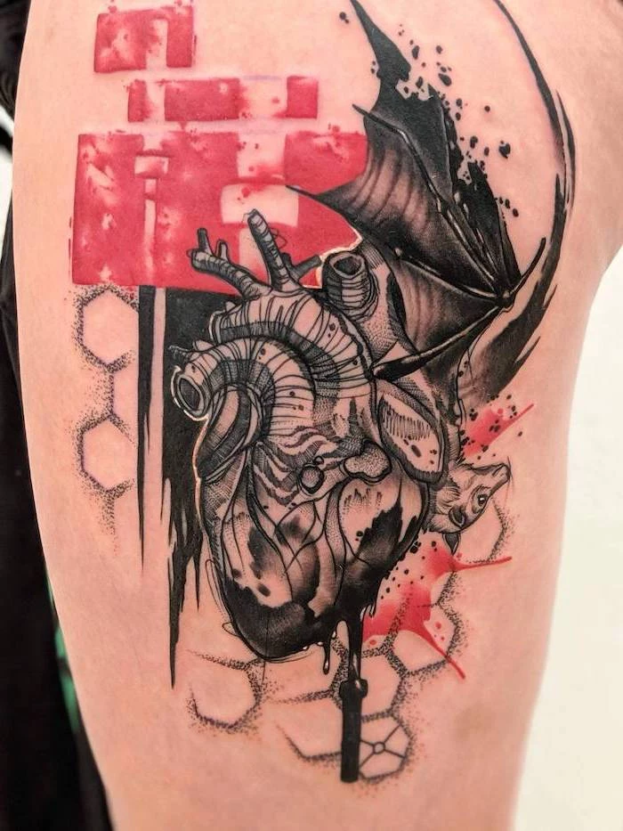 heart with bat in the back trash polka design surrounded by red and black lines thigh tattoo