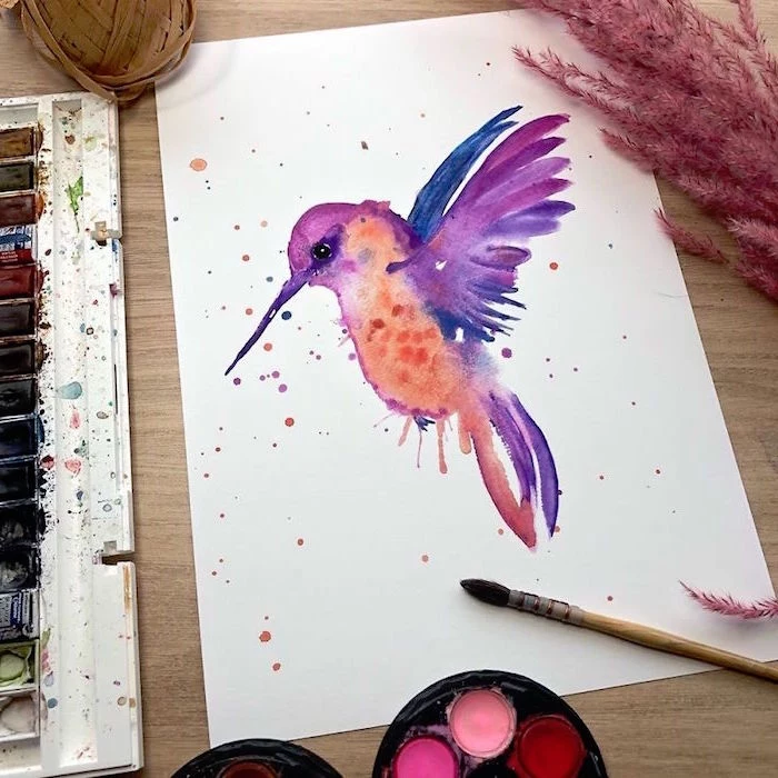 painting of a hummingbird, painted in purple and orange, how to use watercolor paint, painted on white background