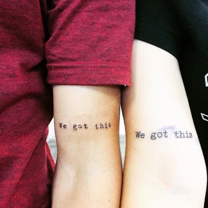 inside arm matching tattoo saying we got this sibling tattoos for 4 man with red t shirt woman with black t shirt