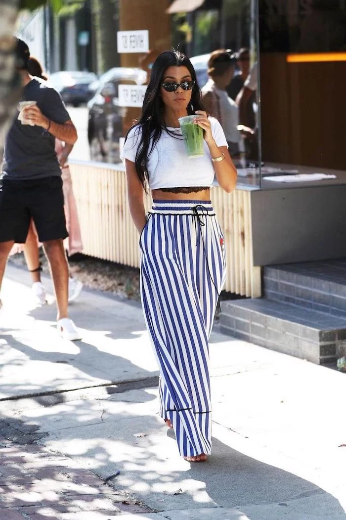 kourtney kardashian wearing blue and white striped wide fit trousers white crop top cute casual outfits