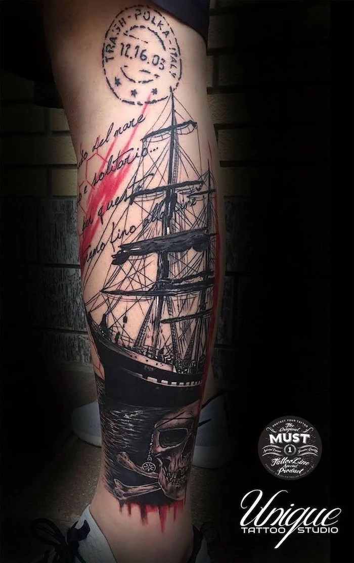 leg tattoo of large ship at sea trash polka style message written on the side pirate skull underneath