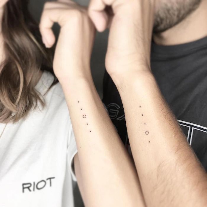 matching tattoos on the side of the forearm matching sibling tattoos dots with circles
