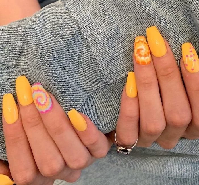 yellow nail polish, medium length coffin nails, bright nail colors, tie dye decorations