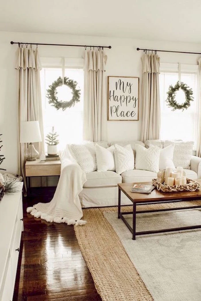 white walls, white sofa, wooden coffee table, country decorating ideas, white carpet on dark wooden floor