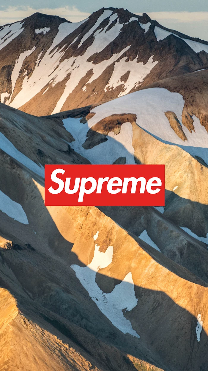 mountain landscape with snowy peaks supreme wallpaper for iphone red and white supreme logo in the middle