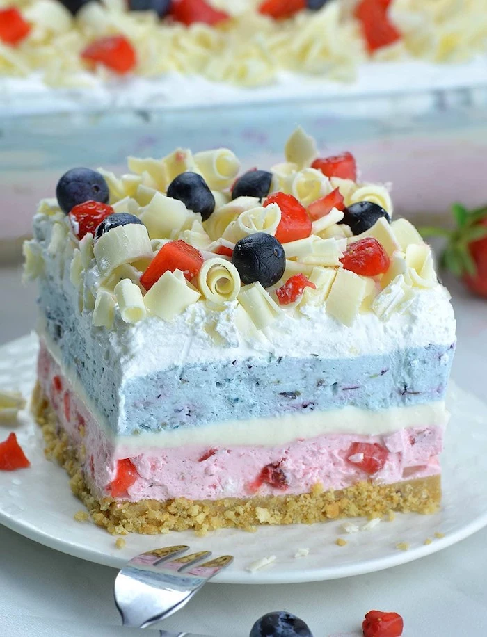 no bake dessert recipes dessert lasagna made with blueberries and strawberries layered and topped with white chocolate strawberries and blueberries