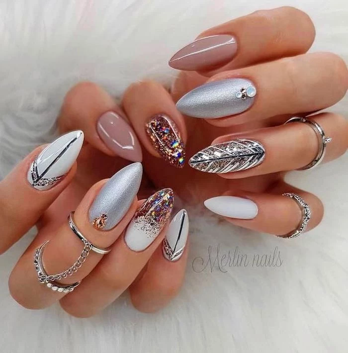 nude and white nail polish, silver glitter nail polish, acrylic nail colors, decorations with rhinestones, long almond nails