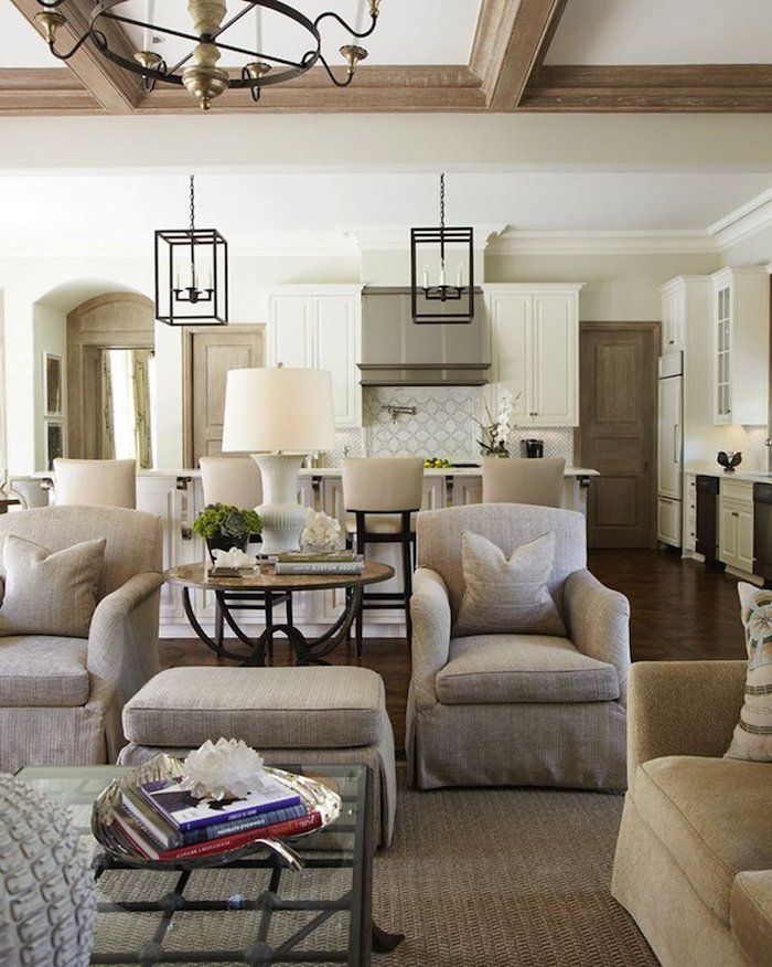 two grey armchairs and ottoman, country decorating ideas, open plan living room and kitchen