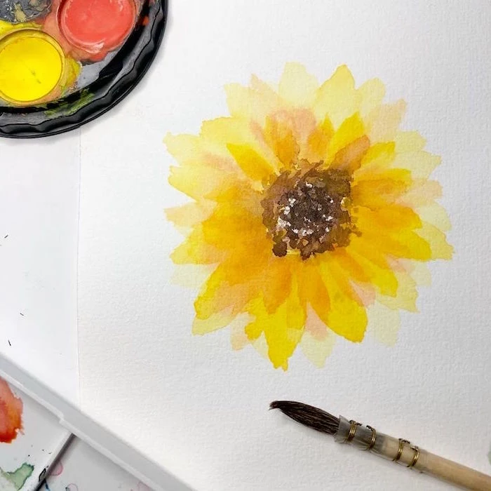 orange yellow watercolor sunflower, how to use watercolor paint, painted on white background, paintbrush on the side