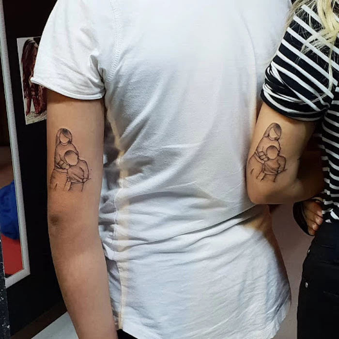 outlines of brother and sister from photo brother sister matching tattoos back of arm tattoos