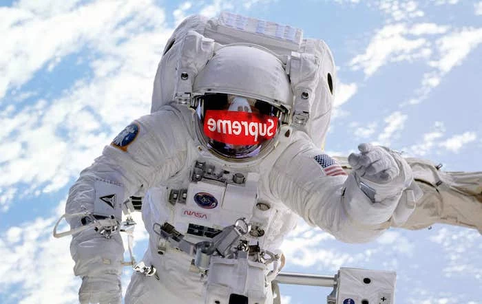 photo of a nasa astronaut in space supreme louis vuitton wallpaper supreme logo mirrored on his helmet