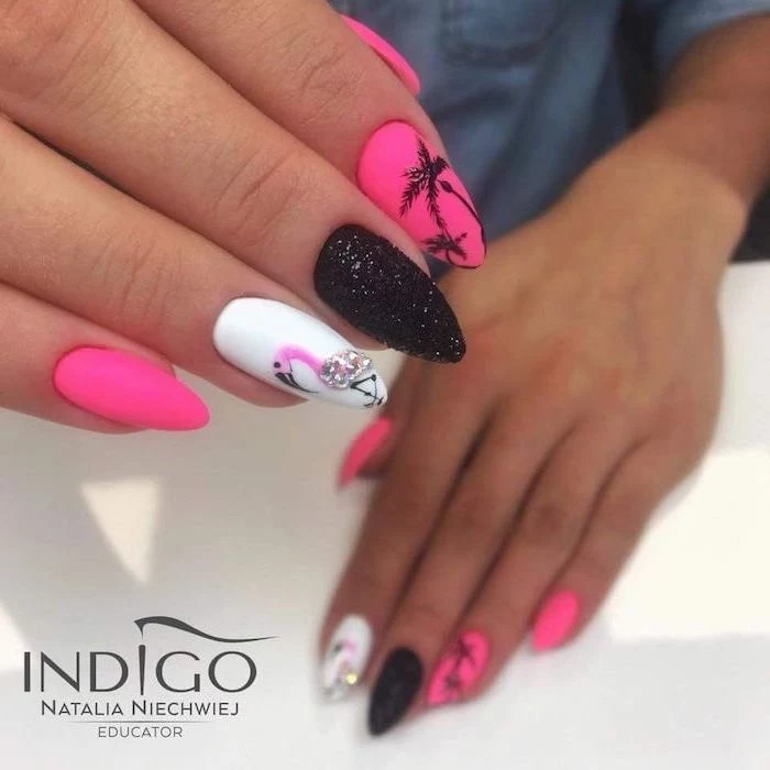 pink and white nail polish, black glitter nail polish, flamingos and palm trees decorations, pretty nail designs