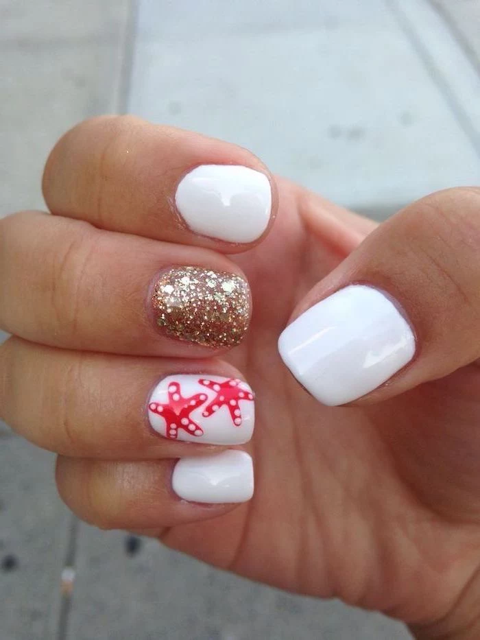 cute acrylic nail ideas, white nail polish, gold glitter nail polish, sea stars decorations