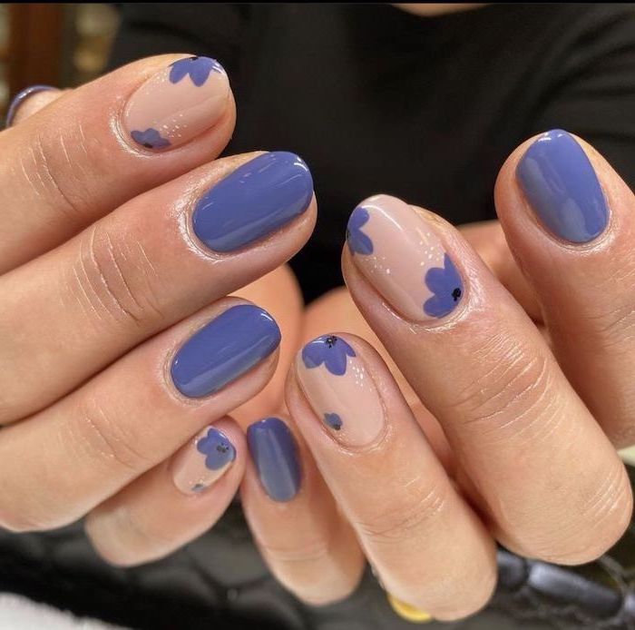 purple nail polish, short squoval nails, purple flower decorations, nude nail polish