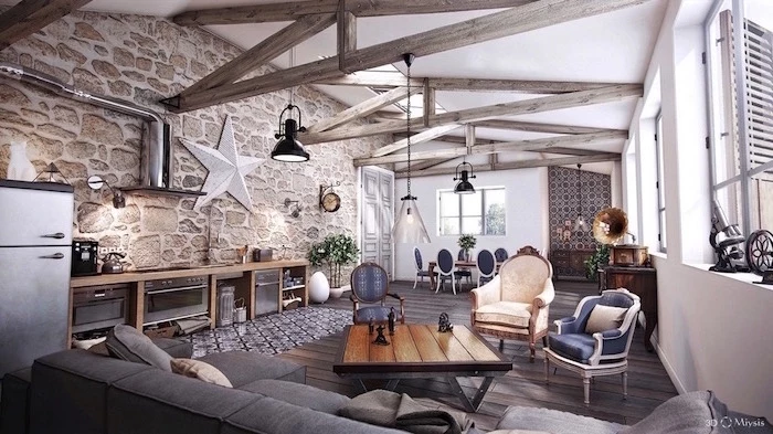 stone accent wall, exposed wooden beams on white ceiling, modern farmhouse interior, grey corner sofa, open plan living room and kitchen