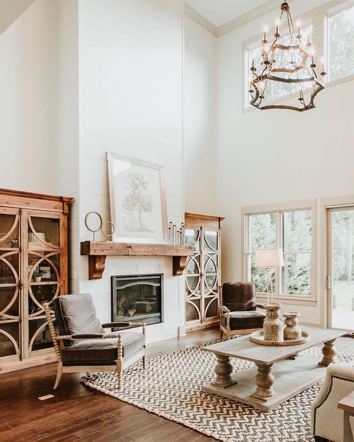 black armchair, wooden coffee table, placed in front of a fireplace, modern farmhouse interior, carpet on wooden floor