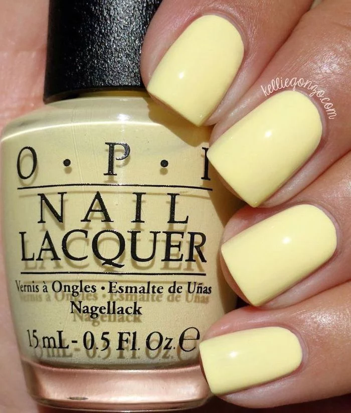 yellow nail polish, vacation nails, short square nails, bottle of yellow nail polish