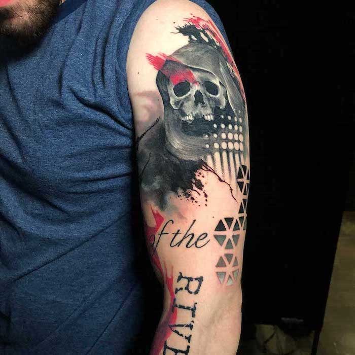 shoulder tattoo of death trash polka tattoo ideas skull with black robe on man wearing blue t shirt