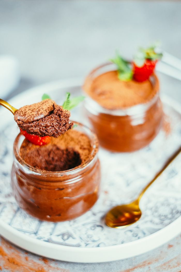 spoonful of chocolate mousse easy dessert recipes no baking two glass jars placed on white plate with grey decorations