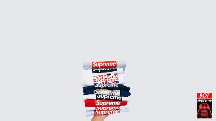 supreme background a bunch of folded t shirts in black and white stacked together on white background