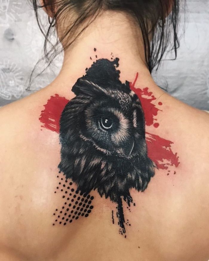 trash polka style black owl surrounded by red and black lines and dots back tattoo on woman with black hair