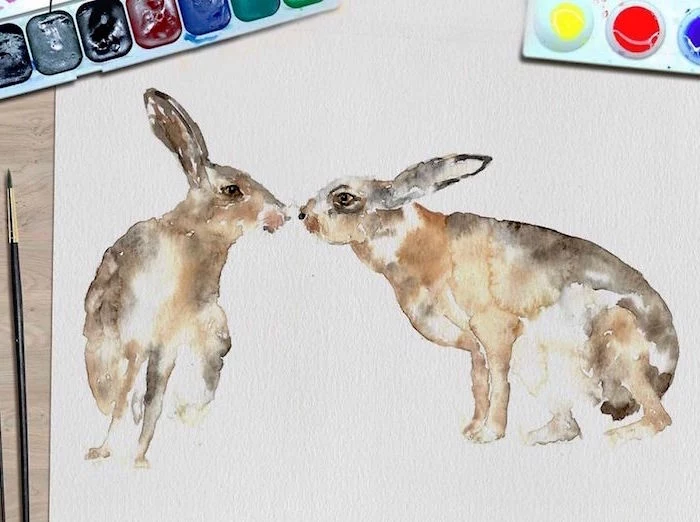 painting of two rabbits, things to paint with watercolor, painted on white background, placed on wooden surface