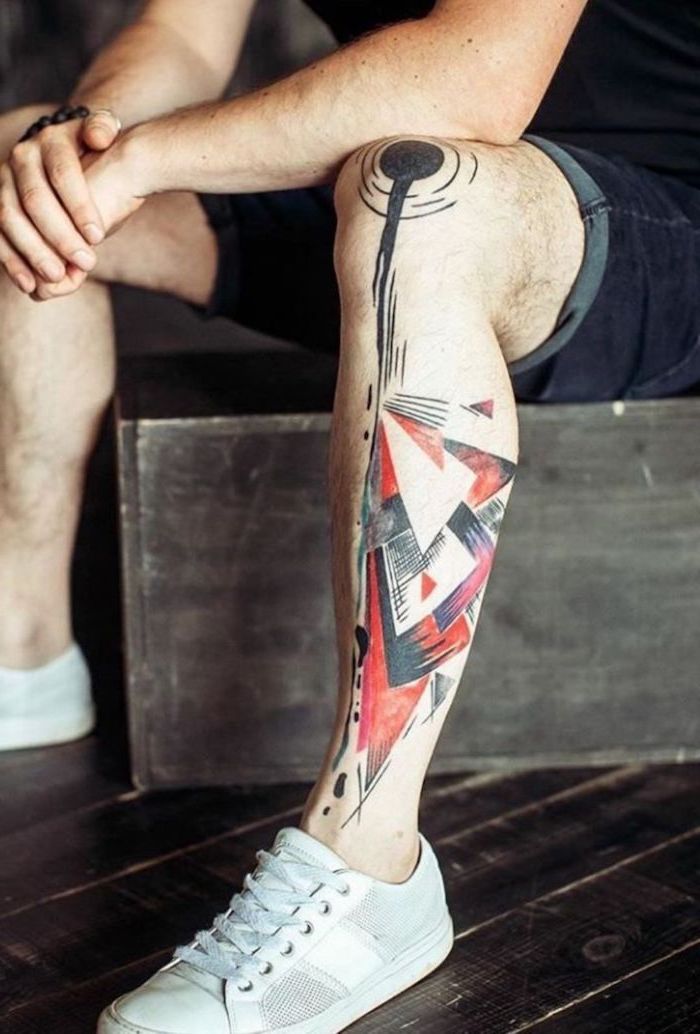 white sneakers short jeans trash polka style leg tattoo on man abstract triangles geometrical shapes