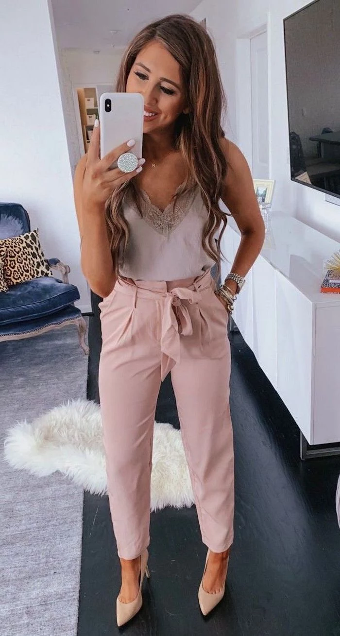 woman wearing white lace top pink trousers with high waist summer outfit ideas beige heels