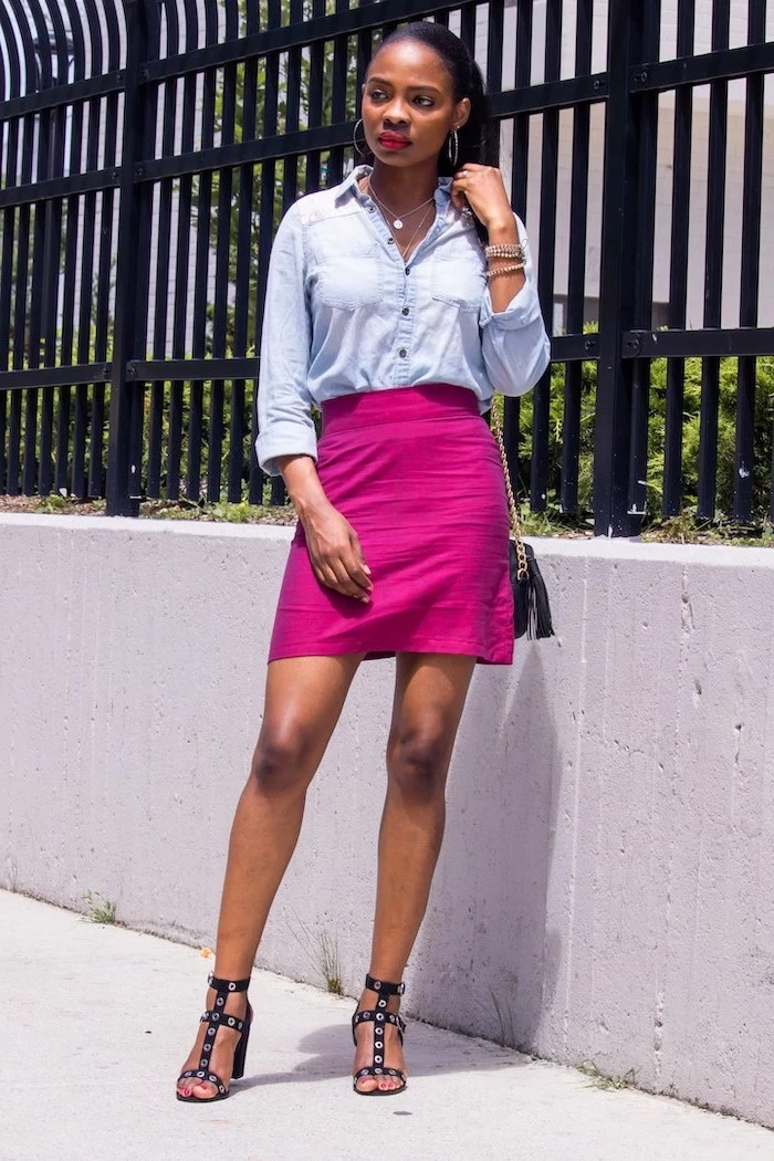 woman with black hair in ponytail cute summer shirts wearing pink skirt denim shirt black sandals small crossbody bag