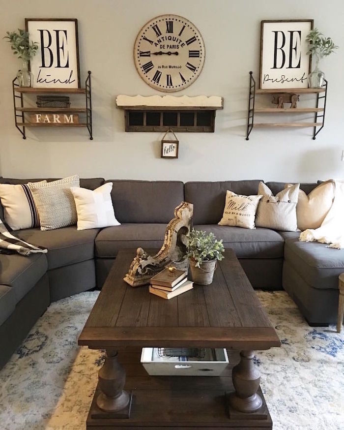 country farmhouse decor, grey corner sofa, wooden coffee table, white carpet and walls