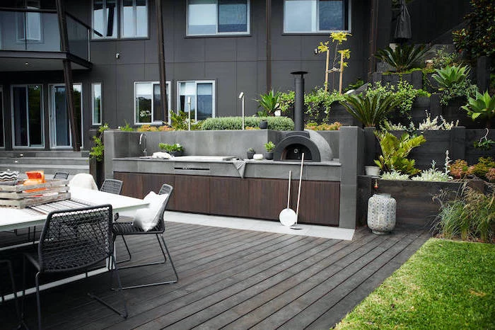 wooden floor and cabinets how to build an outdoor kitchen stone tiled countertops dining table with dark grey metal chairs