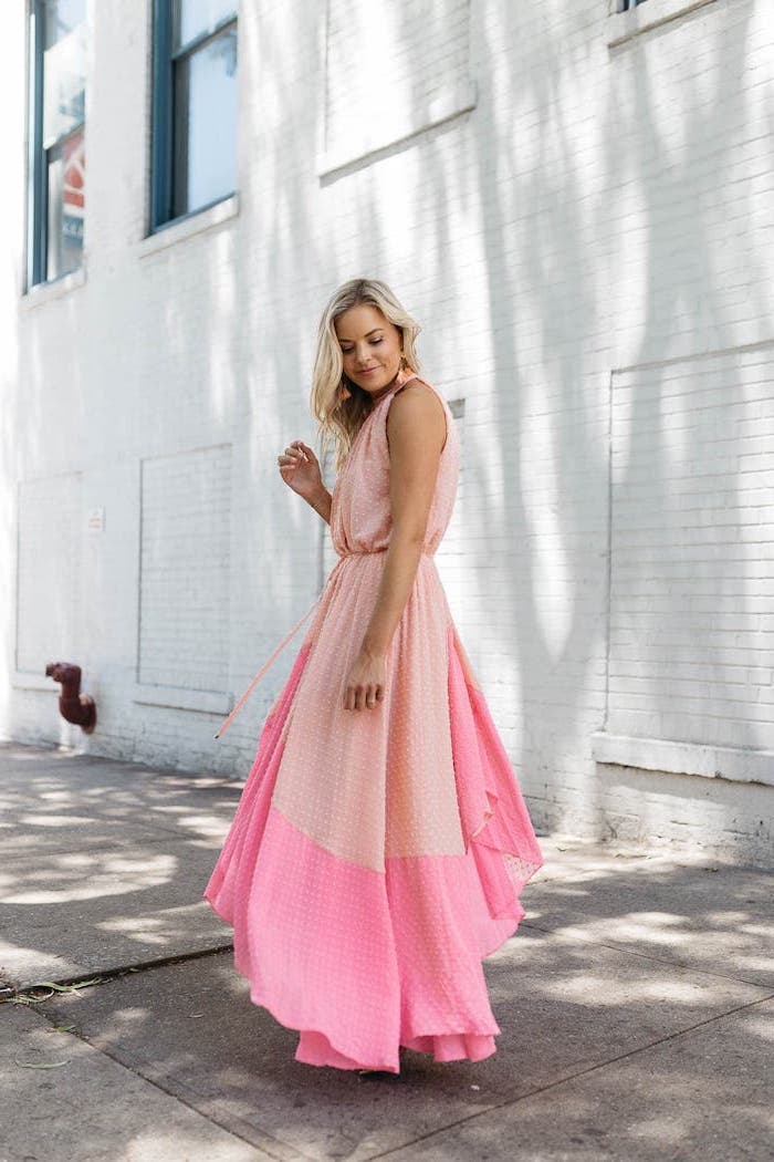 beautiful dresses to wear to a wedding blonde woman wearing long wrap around dress in baby pink and darker pink