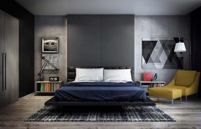 black accent wall behind bed with black leather bed frame bedroom wall decor ideas grey cement walls wooden floor with black and white carpet