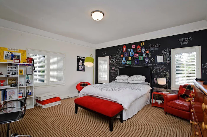 black chalkboard behind the bed boys bedroom decor red orroman leather chair white bookshelf