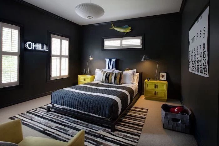 black walls chill neon sign green night stands on both sides of the bed boys bedroom decor black and white carpet