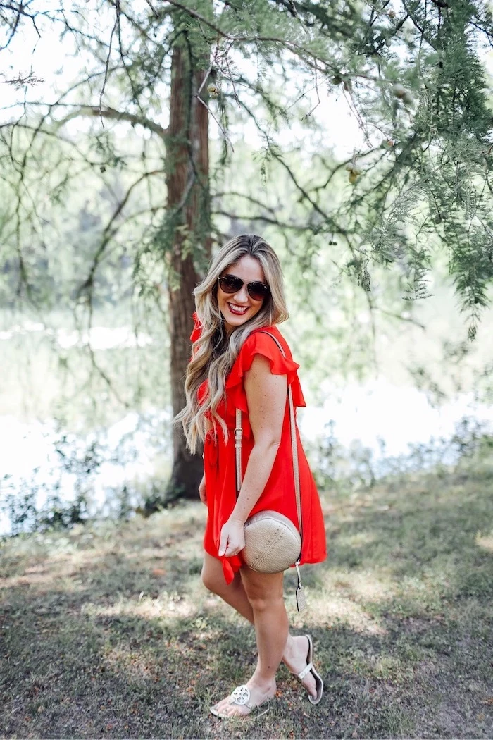 blonde woman wearing red dress cute summer dresses sunglasses beige leather crossbody bag